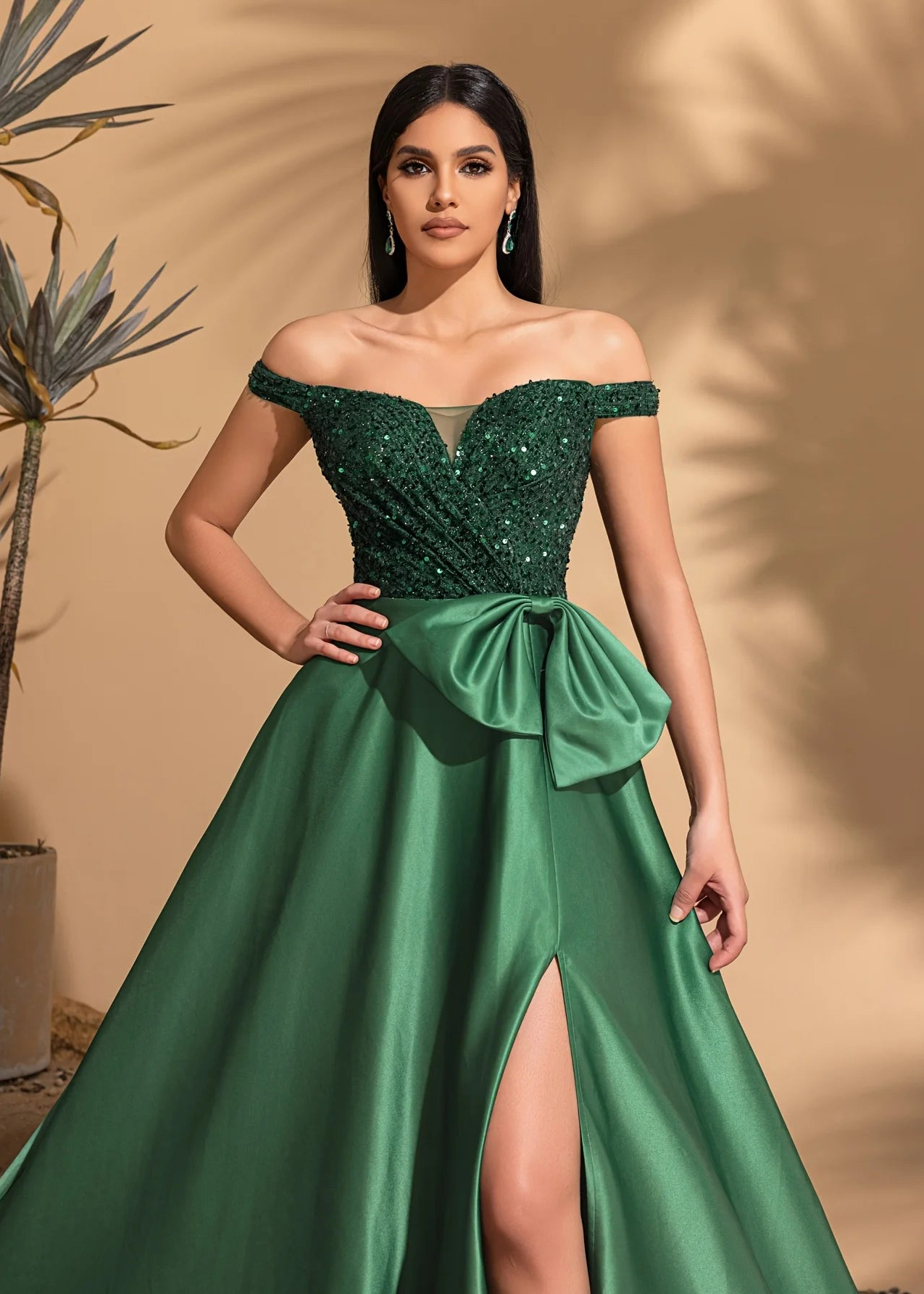 One-shoulder dress with bow decoration at waist and sequined satin hem