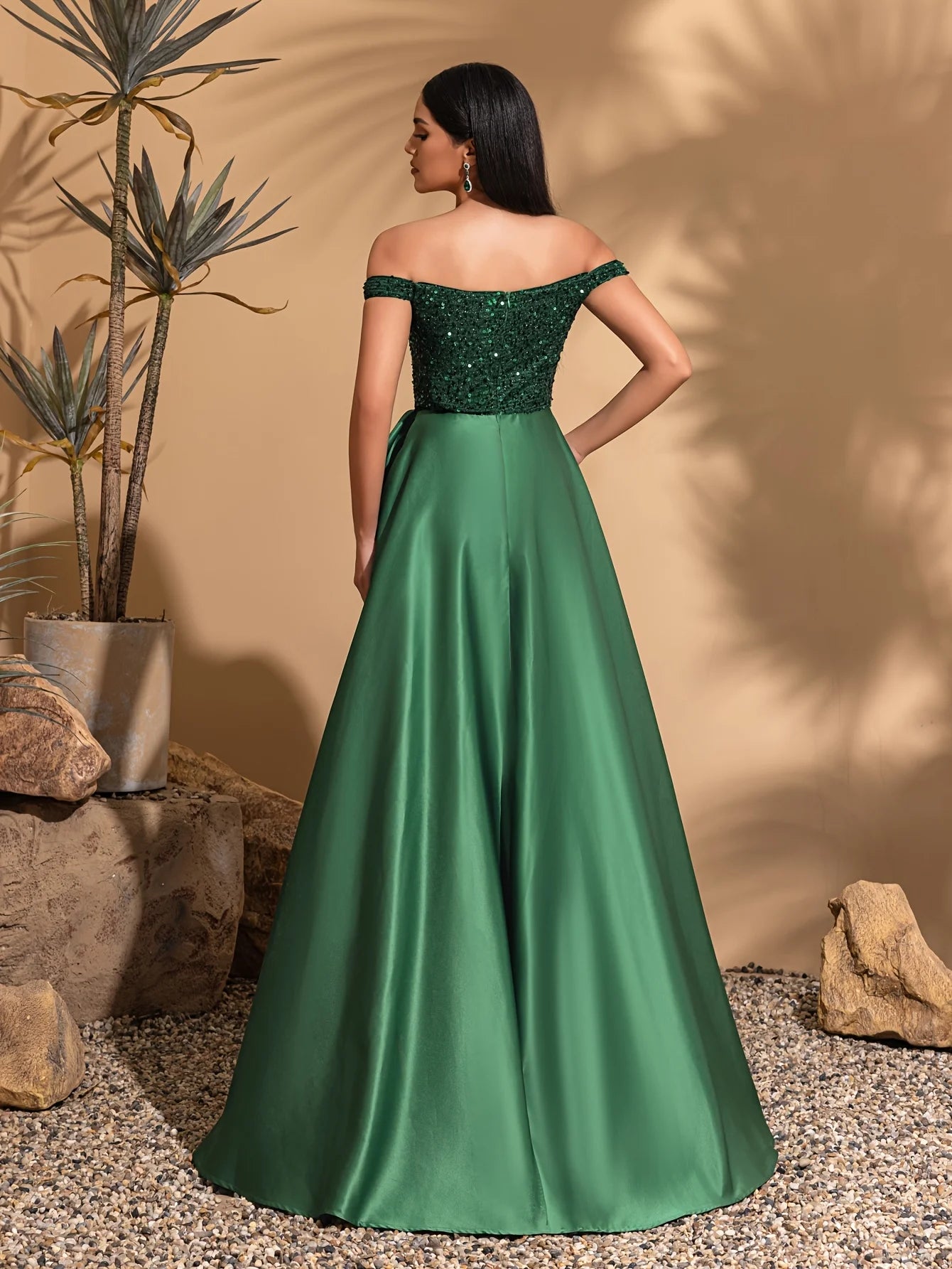 One-shoulder dress with bow decoration at waist and sequined satin hem