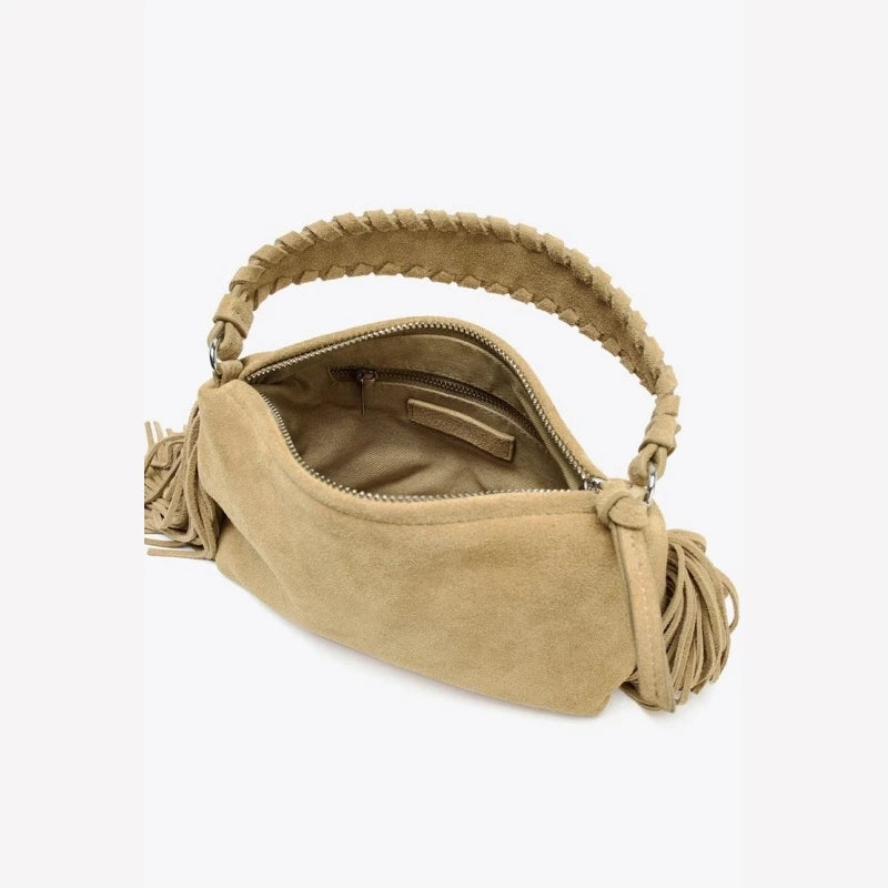 Compact crossbody bag with tassels.