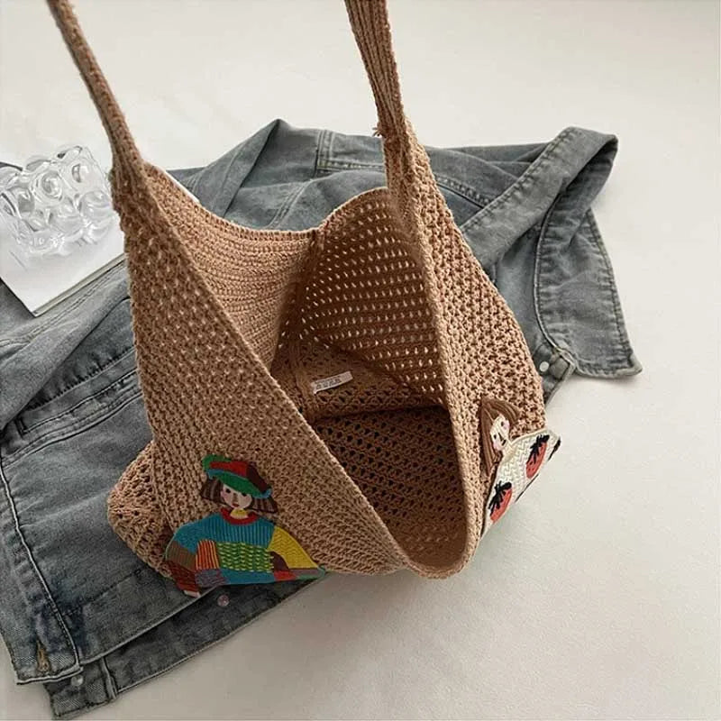 Lightweight woven shoulder bag for casual use.