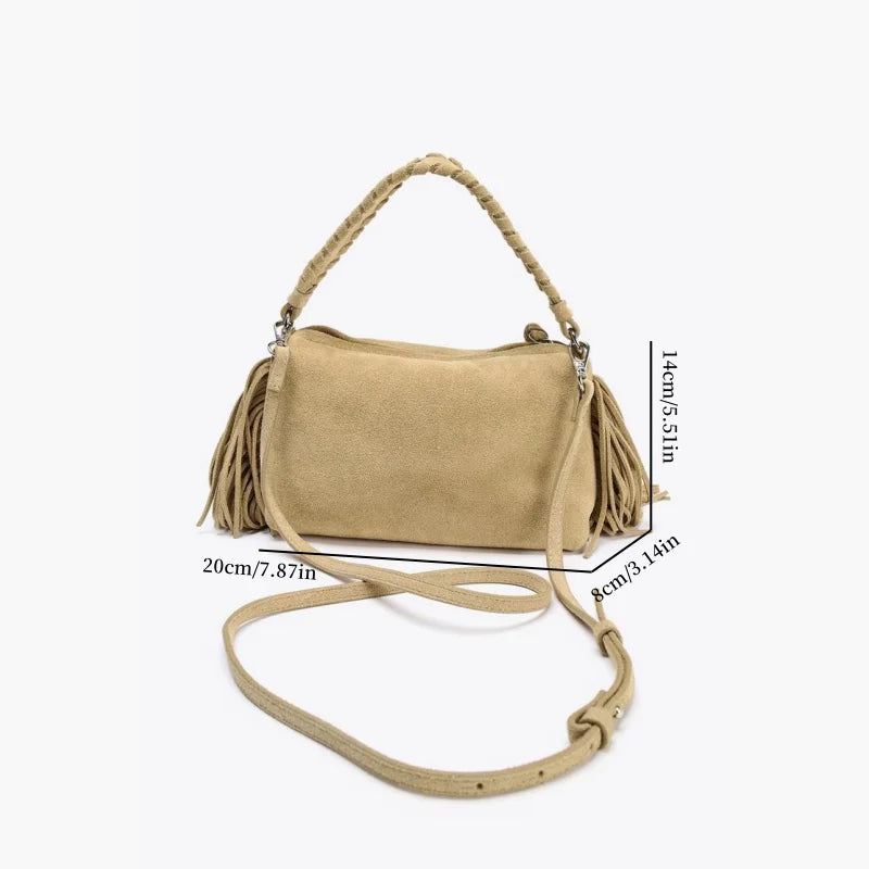 Compact crossbody bag with tassels.
