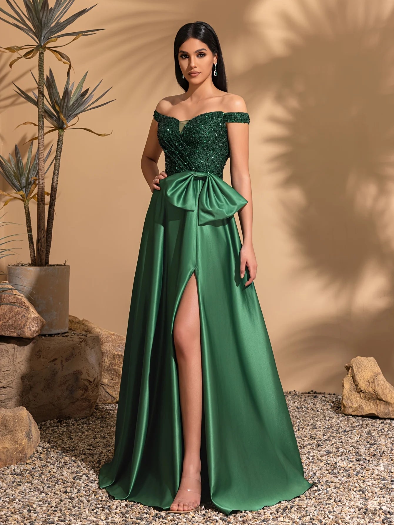 One-shoulder dress with bow decoration at waist and sequined satin hem