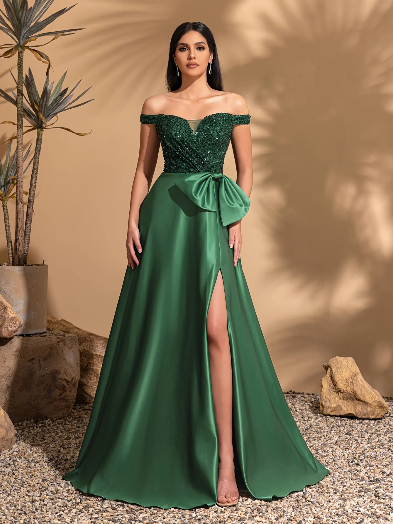 One-shoulder dress with bow decoration at waist and sequined satin hem